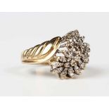 A 9ct gold and diamond ring, mounted with circular cut diamonds in a twist design, import mark