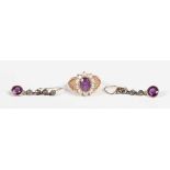 A 9ct gold, amethyst and half-pearl oval cluster ring, claw set with the oval cut amethyst within