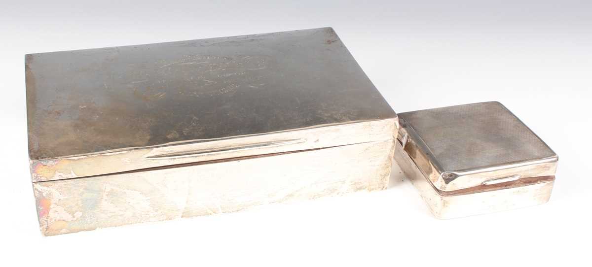 An Edwardian silver mounted cigar box, London 1905, length 23cm (distressed), and a smaller silver