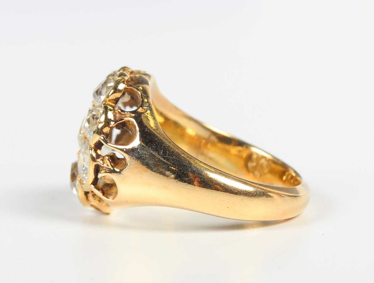 A gold and diamond cluster ring, claw set with a central old mine cut diamond within a surround of - Image 3 of 5