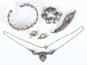 A Danish silver brooch, detailed ‘Sterling Denmark N.E.From 925 S’, width 3.6cm, a silver bangle,