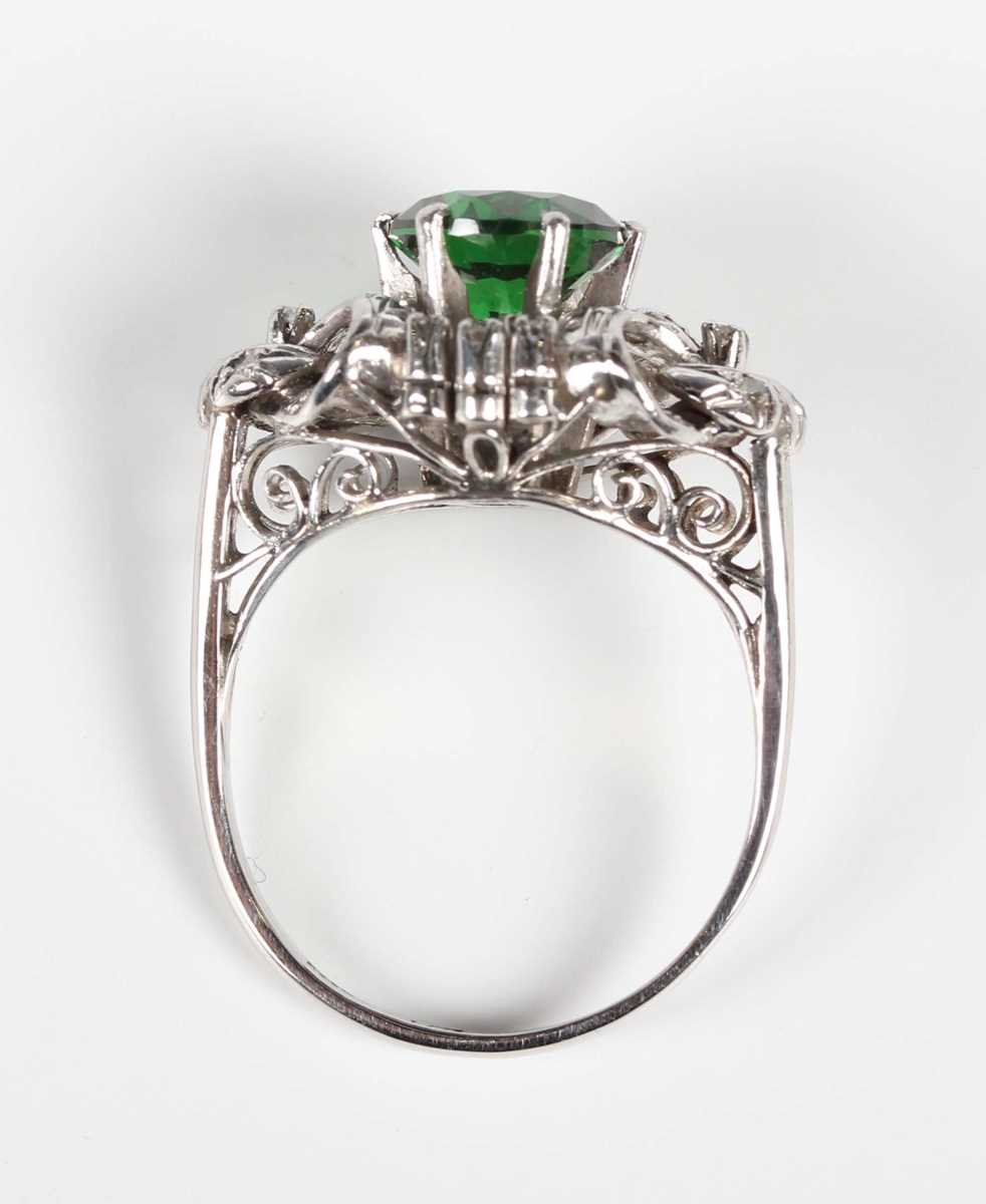 A platinum, demantoid garnet and diamond ring, claw set with the circular cut green demantoid garnet - Image 4 of 5