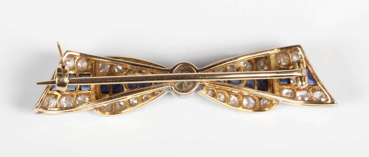 A gold backed and platinum fronted, sapphire and diamond brooch designed as a tied bow, collet set - Image 3 of 3