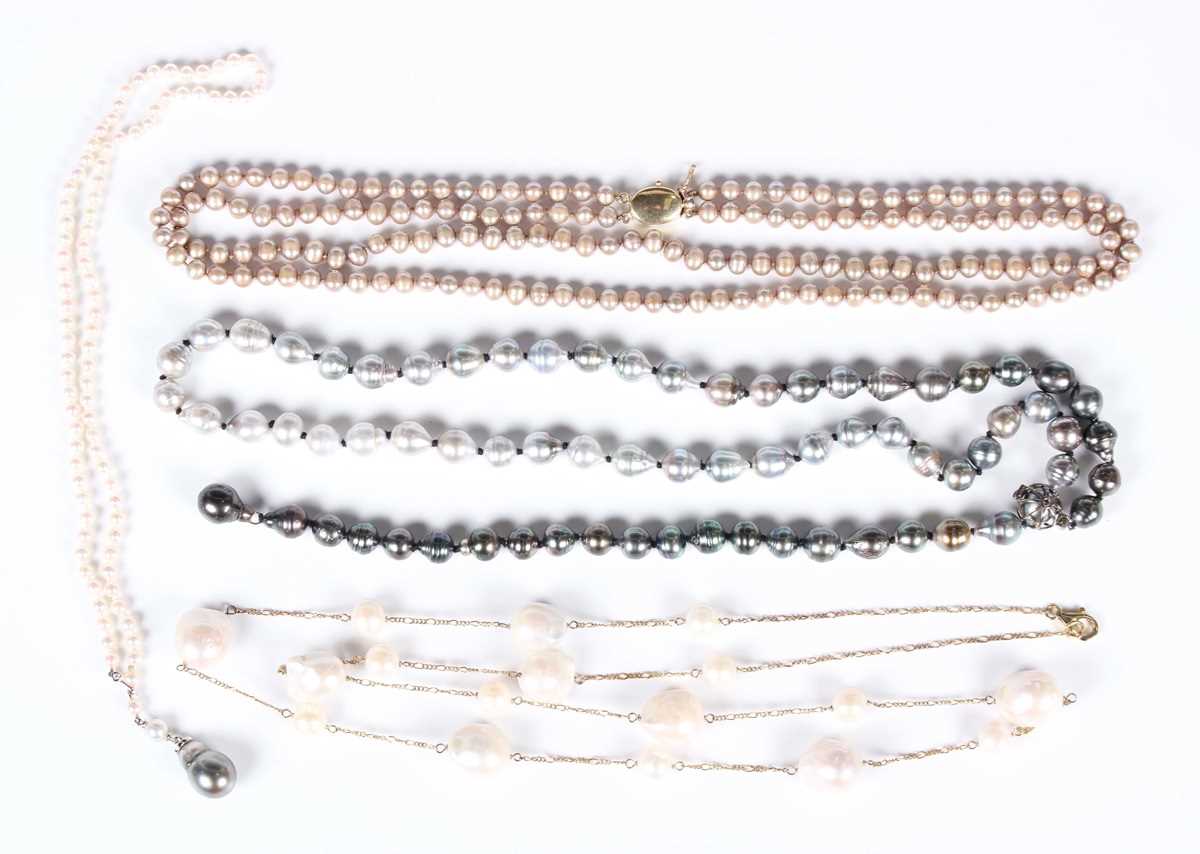 A single row necklace of cultured pearls with a diamond capped Tahitian grey tinted cultured pearl