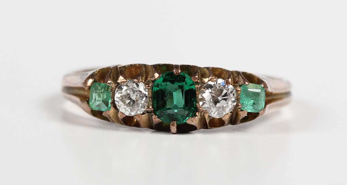 A gold, diamond and green gem set ring, mounted with two old cut diamonds between three green - Image 2 of 5