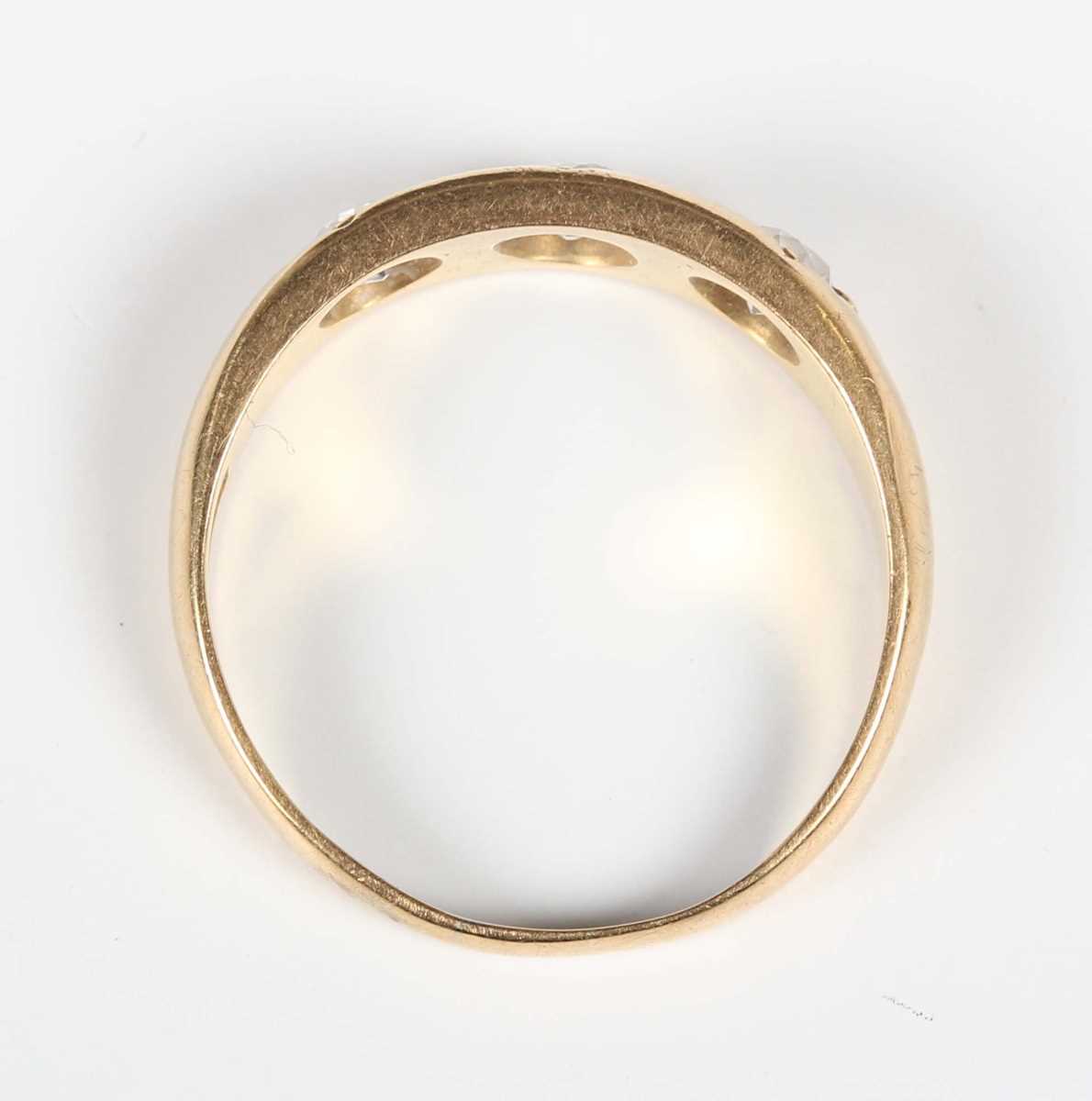 A gold and diamond three stone gypsy ring, mounted with old cut diamonds, detailed ‘18ct’, weight - Image 4 of 5
