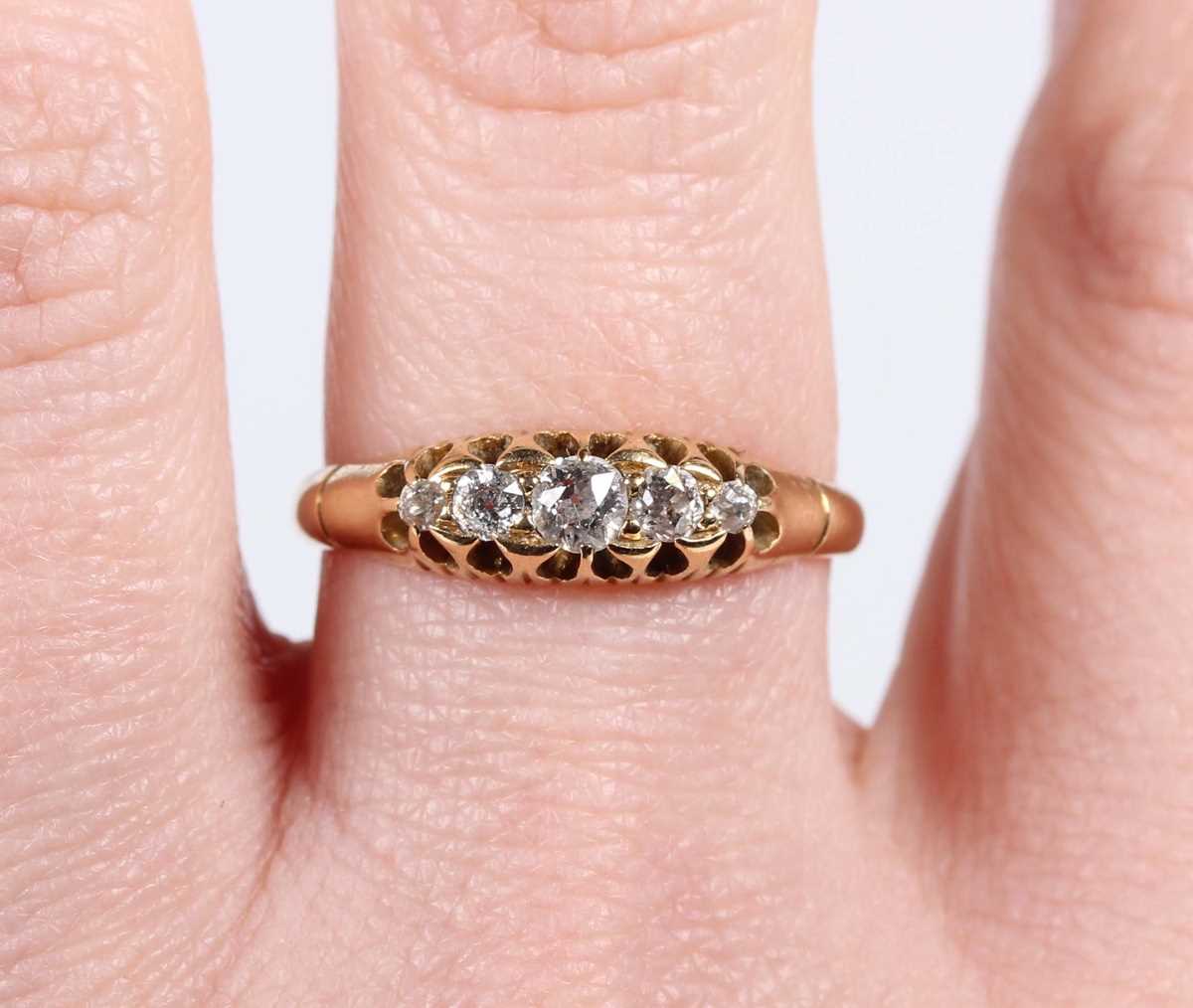 A gold and diamond five stone ring, mounted with old cut diamonds graduating in size to the centre - Image 5 of 5