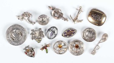 Fifteen mostly silver brooches, including three of circular Celtic design with sailing ship