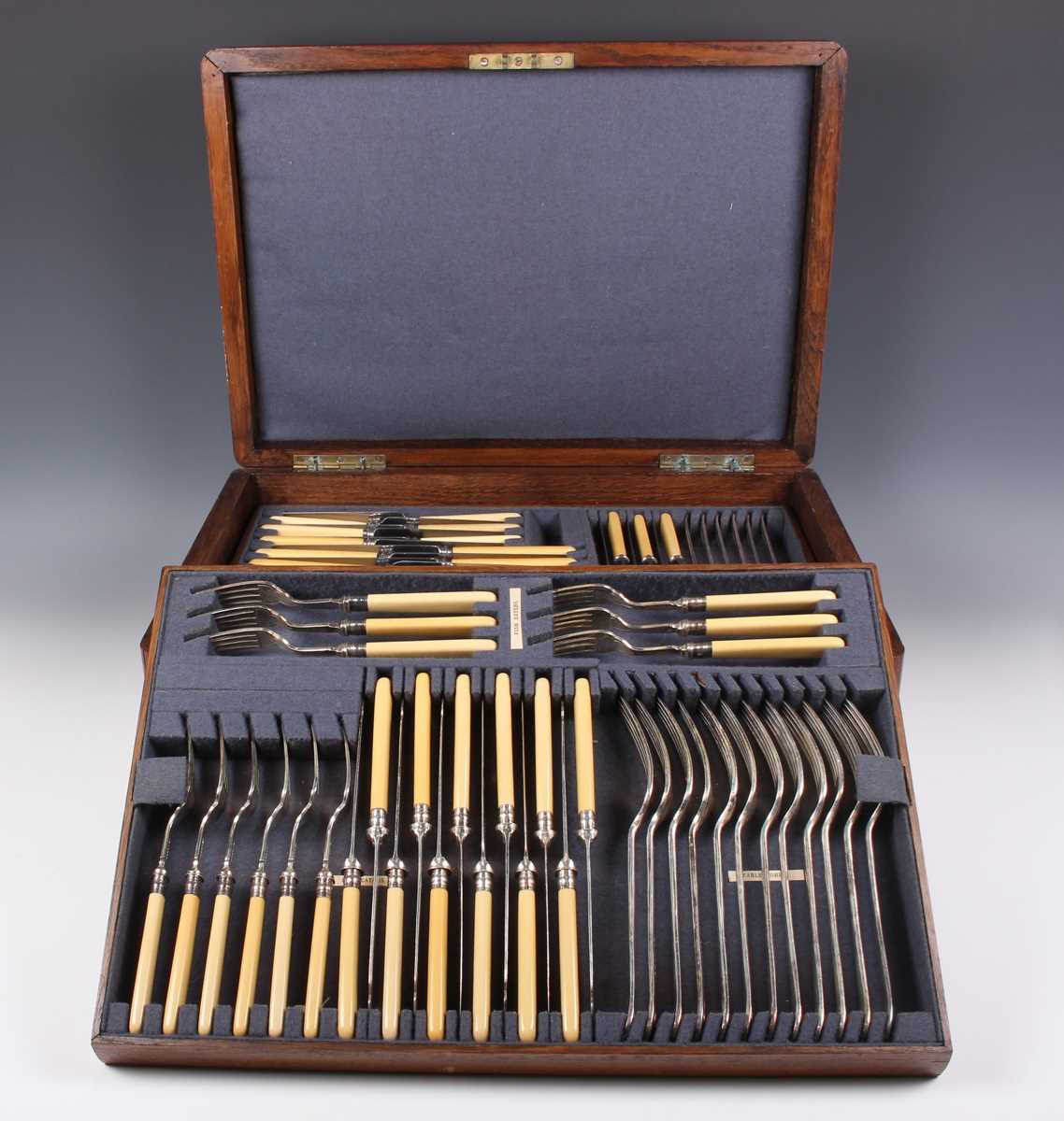 A Walker & Hall part canteen of plated Queen Anne pattern cutlery, comprising six tablespoons,