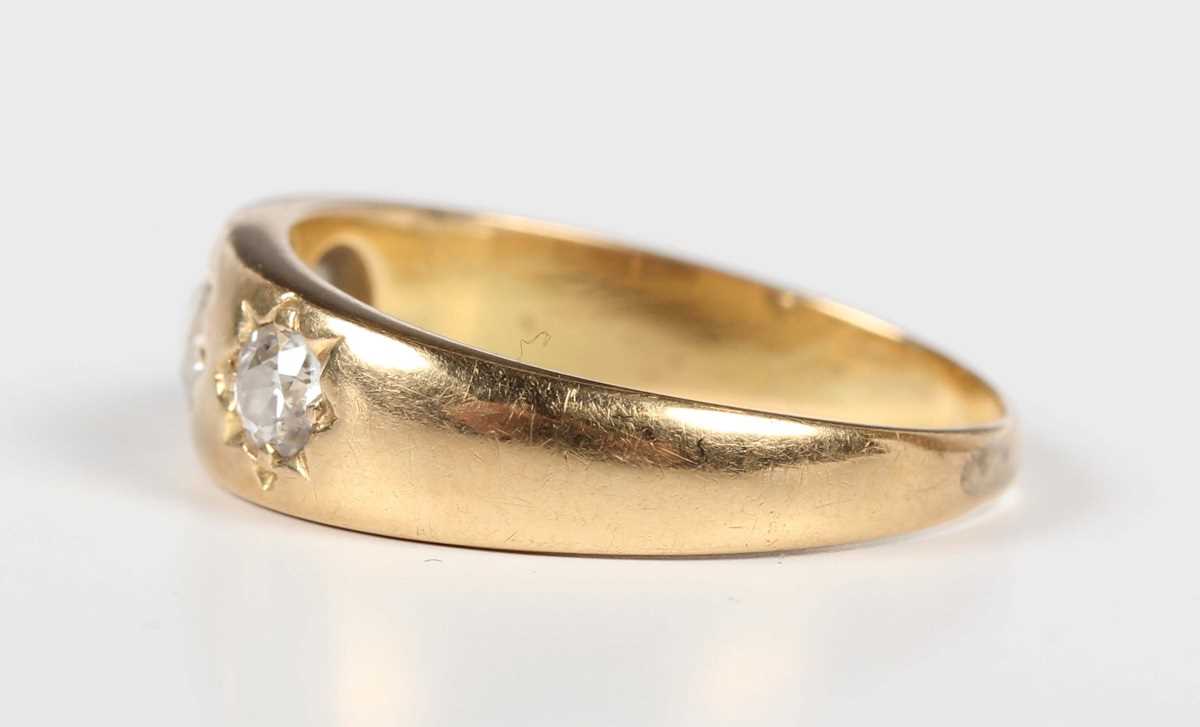 A gold and diamond three stone gypsy ring, mounted with old cut diamonds, detailed ‘18ct’, weight - Image 3 of 5