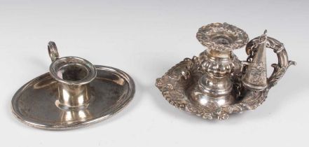 A George IV silver chamberstick, embossed with flowers and scrolls, fitted with a scroll handle,