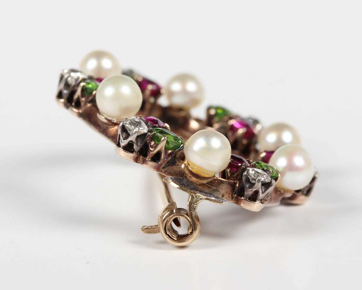 A gold backed, diamond, ruby, demantoid garnet and pearl brooch, designed as a wreath with trefoil - Image 3 of 5