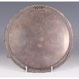 A George III silver circular card salver with pierced and cast gadrooned rim, on pierced scroll