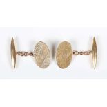 A pair of 9ct gold cufflinks, each oval front with engine turned decoration, Birmingham 1963, weight