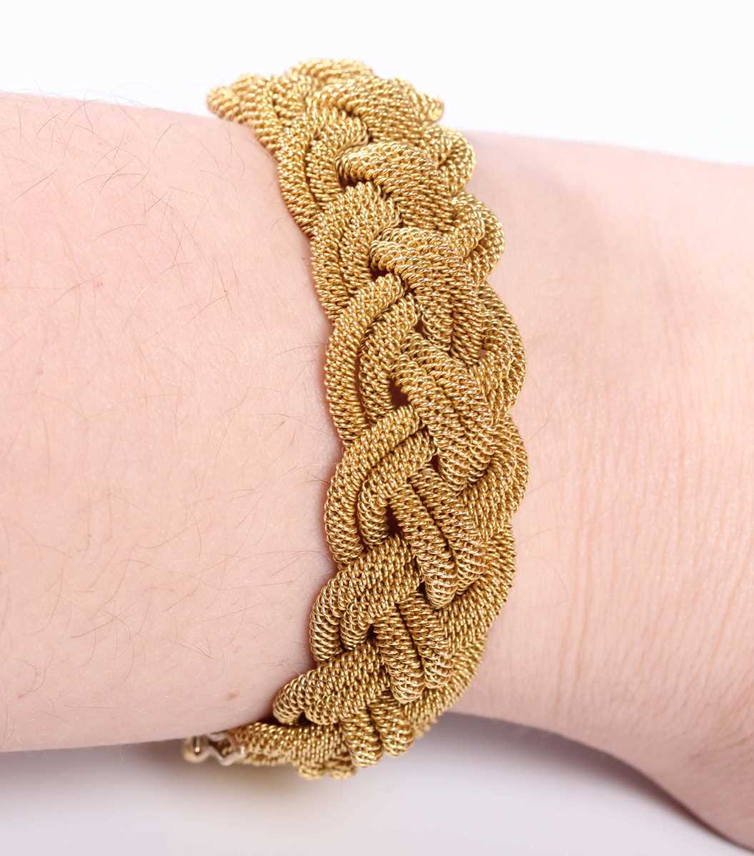 A gold bracelet in an interwoven ropetwist form design, on a sliding clasp, detailed ‘18A B’, weight - Image 5 of 5