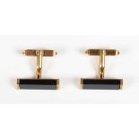 A pair of 18ct gold and black onyx cufflinks, each formed as a rectangular black onyx, with