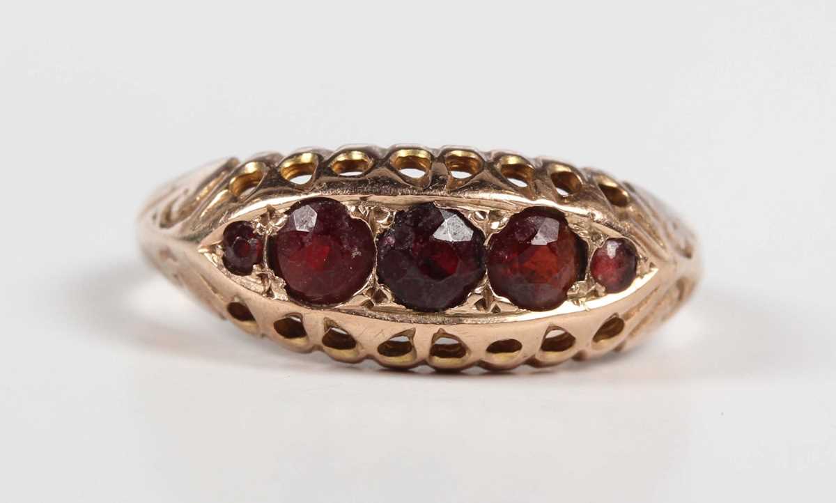 A 9ct gold and garnet five stone ring in a boat shaped design, Chester 1920, weight 1.7g, ring - Image 2 of 5