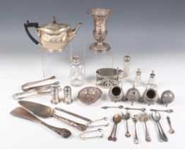 A group of silver, including a half-reeded bachelor's teapot, London 1912, an oval mustard with