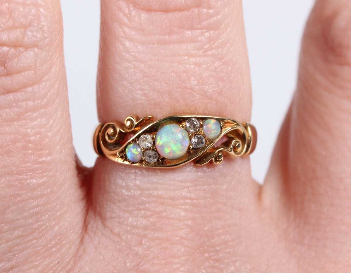 An Edwardian 18ct gold, opal and diamond ring, mounted with three opals and two pairs of old cut - Image 5 of 5