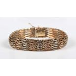 A 9ct three colour gold mesh link bracelet on a snap clasp, import mark Sheffield 1985, weight 22.