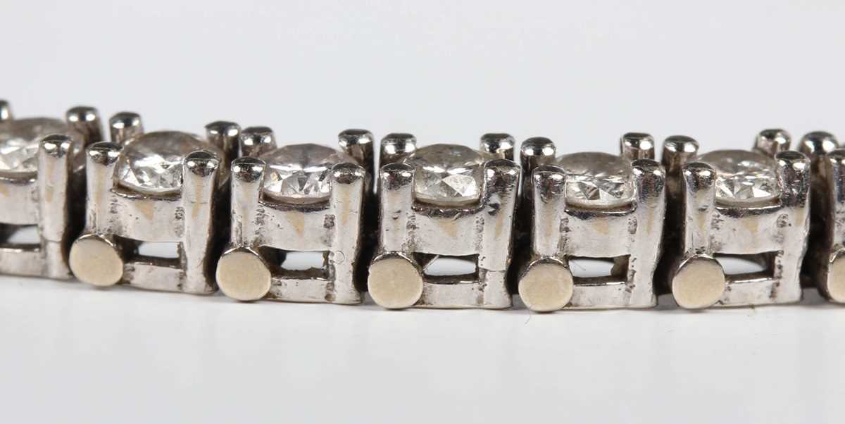 A diamond line bracelet, claw set with a row of circular cut diamonds, on a snap clasp with a - Image 2 of 3