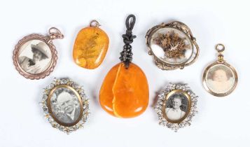 A semi-opaque mottled butterscotch amber drop shaped pendant, total weight 15.2g, dimensions of