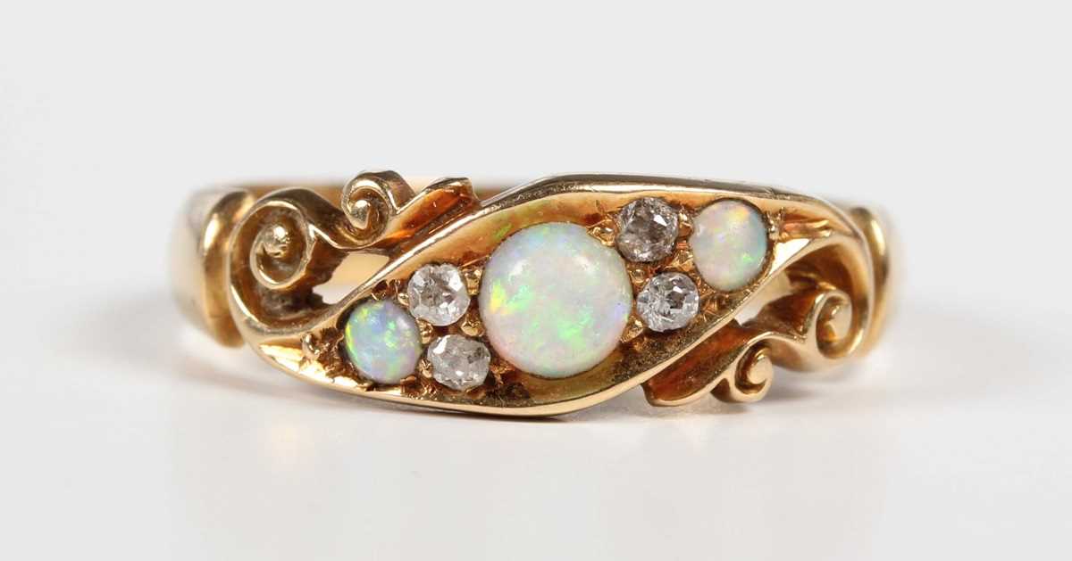 An Edwardian 18ct gold, opal and diamond ring, mounted with three opals and two pairs of old cut - Image 2 of 5