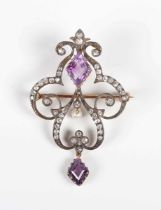 A gold and silver, diamond, amethyst and cultured pearl pendant brooch, circa 1900, in a scroll