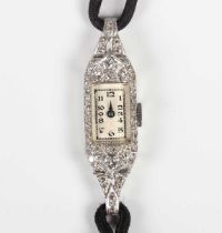 A diamond set lady’s dress wristwatch, the silvered dial with black Arabic numerals, the case