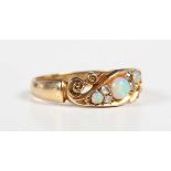 An Edwardian 18ct gold, opal and diamond ring, mounted with three opals and two pairs of old cut