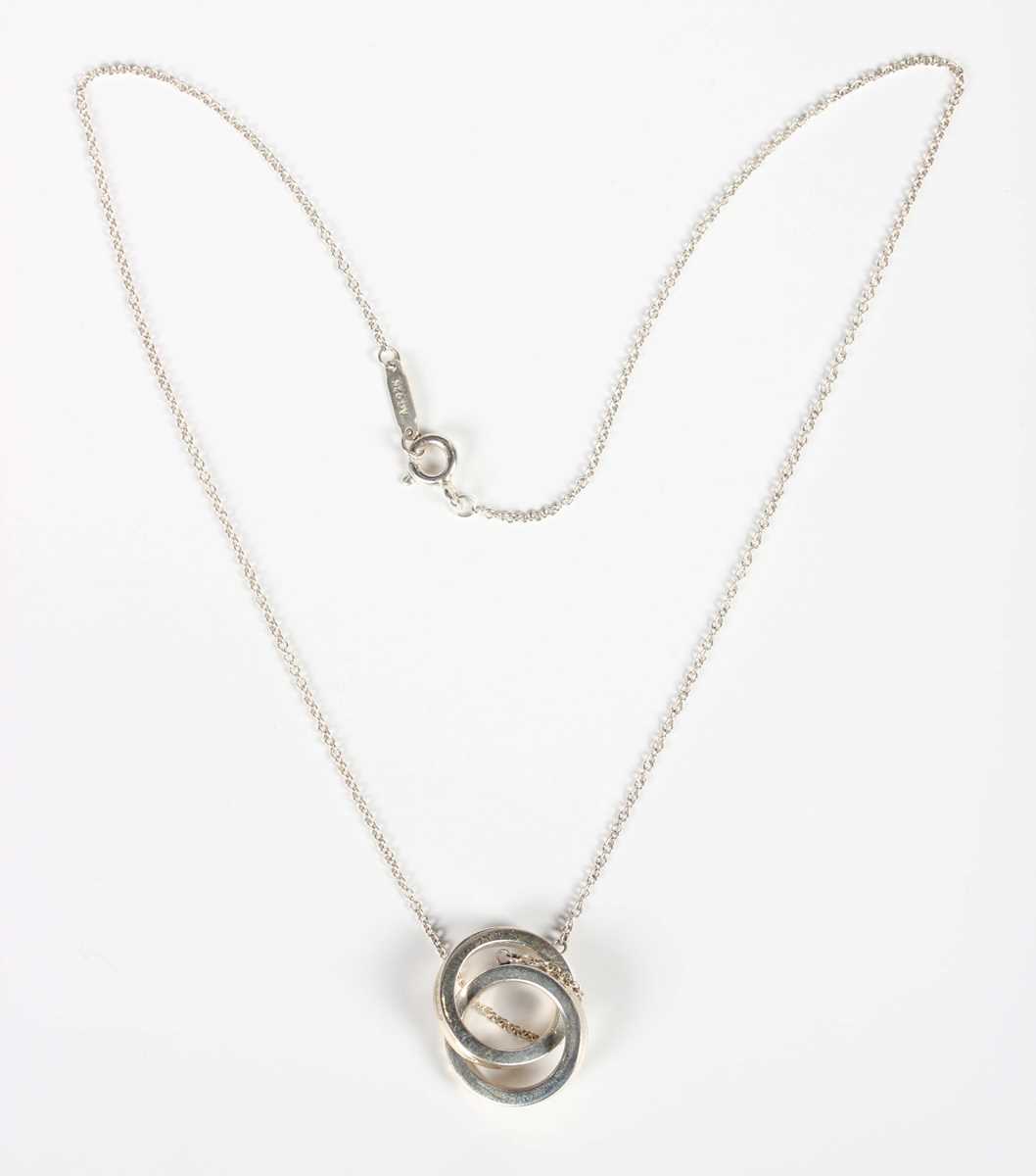 A Tiffany & Co silver interlocking circles pendant with neckchain, detailed ‘Tiffany & Co Ag925’, - Image 4 of 5