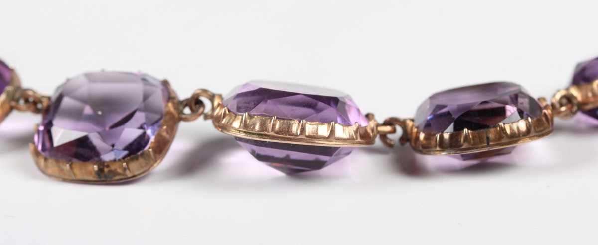 A gold and amethyst necklace, early 19th century, mounted with a row of graduated cushion shaped - Image 2 of 4