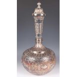 A late 19th century Indian colonial silver presentation bottle and domed cover with reeded knop