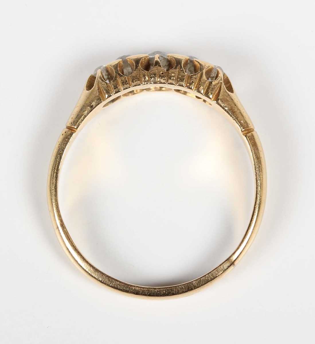 A gold and diamond five stone ring, mounted with old cut diamonds graduating in size to the centre - Image 4 of 5