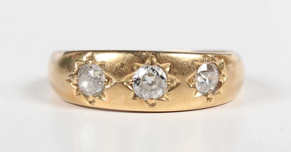 A gold and diamond three stone gypsy ring, mounted with old cut diamonds, detailed ‘18ct’, weight - Image 2 of 5