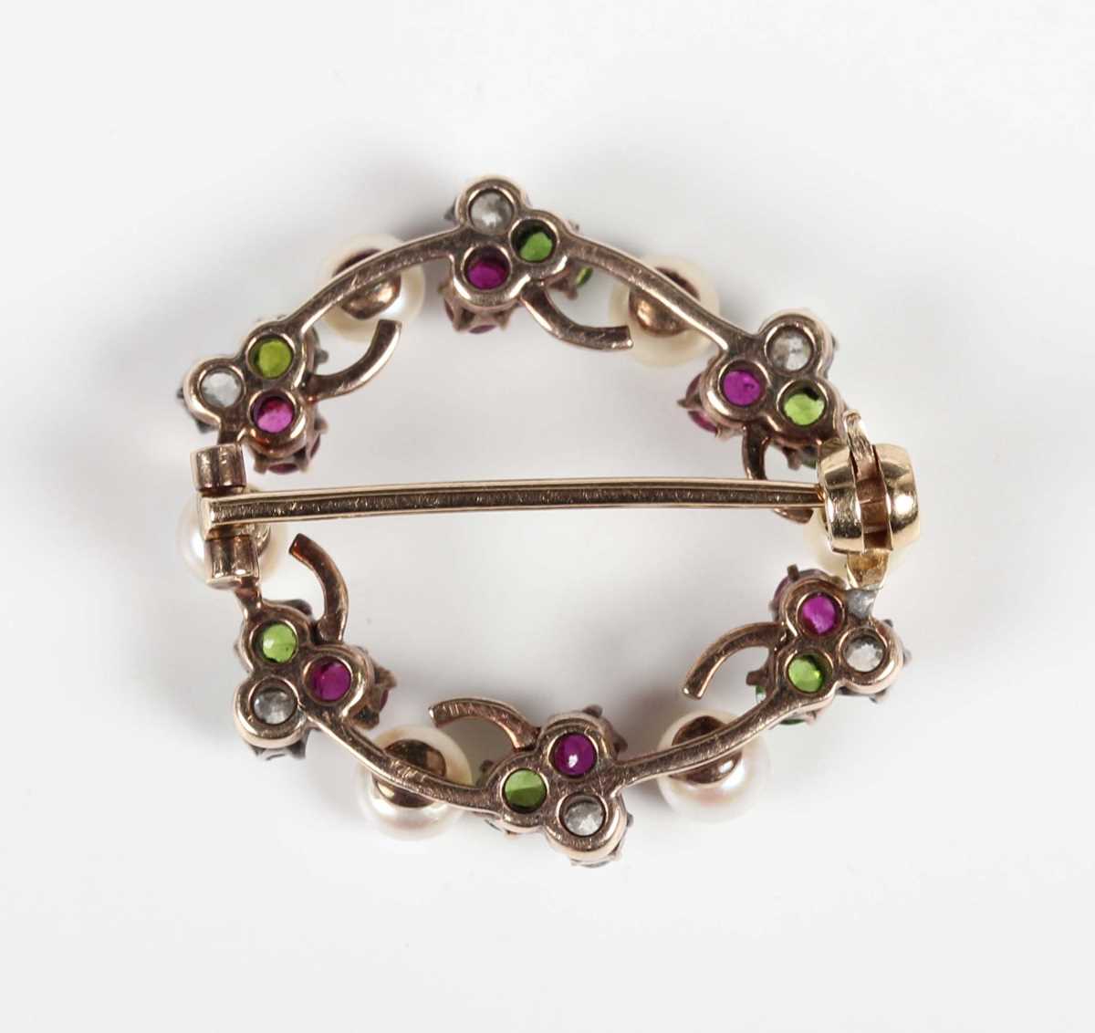A gold backed, diamond, ruby, demantoid garnet and pearl brooch, designed as a wreath with trefoil - Image 2 of 5