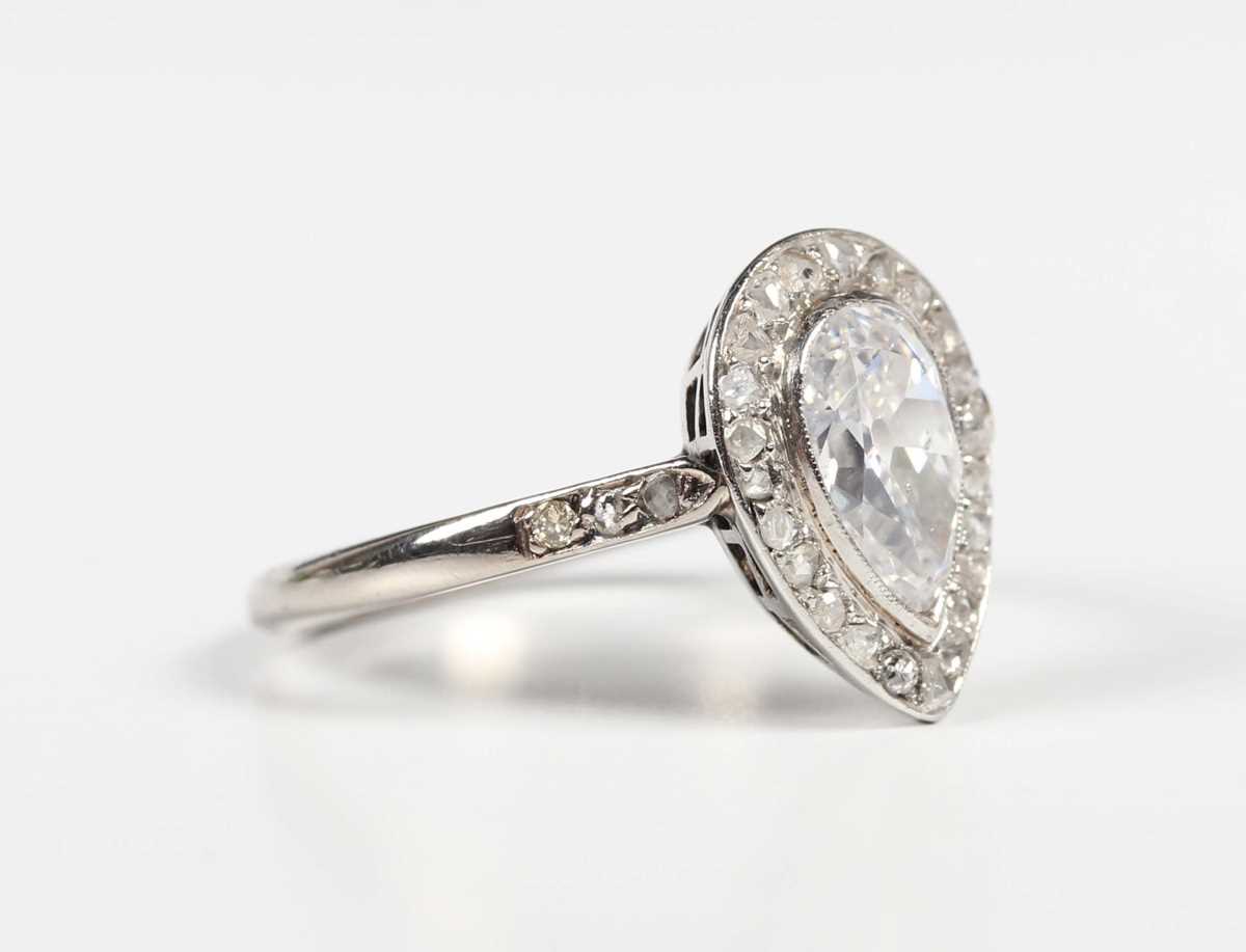 A diamond pear shaped cluster ring, mounted with the principal pear shaped diamond at the centre,