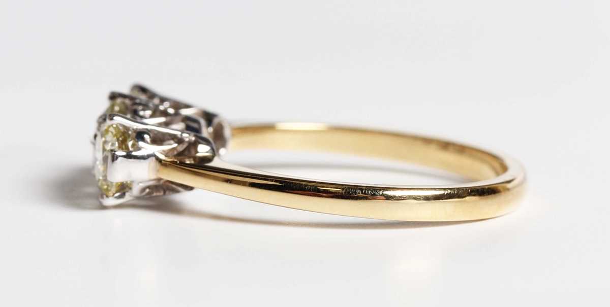 An 18ct gold and diamond three stone ring, claw set with a row of circular cut diamonds, weight 3. - Image 3 of 6