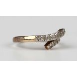 A 9ct gold and diamond ring, mounted with two rows of circular cut diamonds in a twist design,