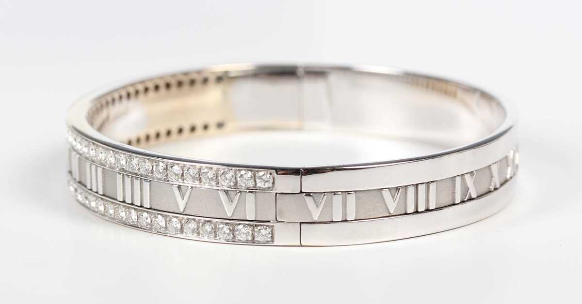 A Tiffany & Co 18ct white gold and diamond Atlas oval hinged bangle, detailed ‘Tiffany & Co 1995 750 - Image 2 of 7