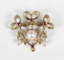 A 9ct gold, ruby and pearl brooch of tied bow and foliate form, Birmingham 1972 by Deakin & Francis,