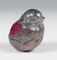 An Edwardian silver novelty pin cushion in the form of a chick emerging from a shell, Chester,