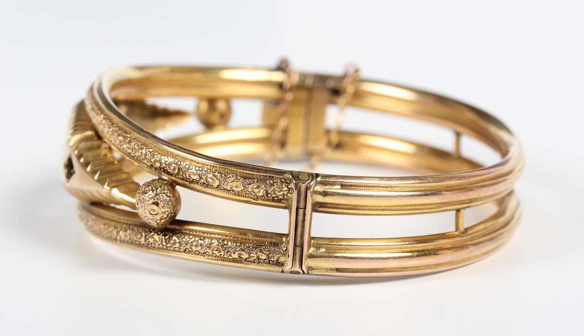 An Edwardian 9ct gold, diamond, blue gem and mauve paste set oval hinged bangle, decorated with - Image 3 of 5