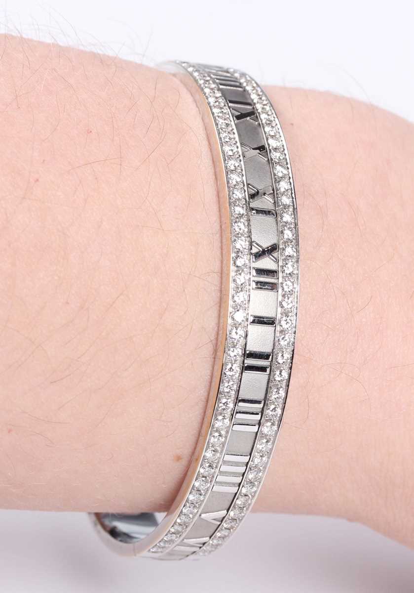 A Tiffany & Co 18ct white gold and diamond Atlas oval hinged bangle, detailed ‘Tiffany & Co 1995 750 - Image 6 of 7