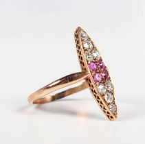 A gold, ruby and diamond marquise shaped cluster ring, mounted with four cushion cut rubies to the