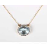 A gold, aquamarine and diamond cluster pendant necklace, the front claw set with an oval cut