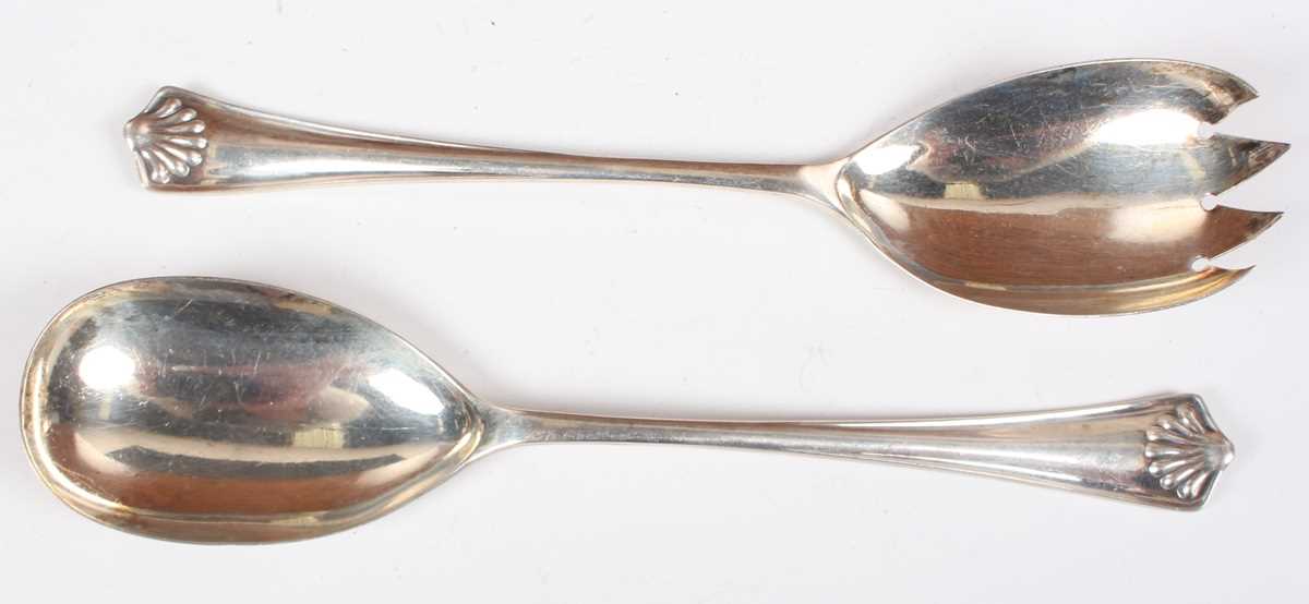 A pair of George V silver salad servers with stylized shell design to each terminal, Sheffield - Image 2 of 6