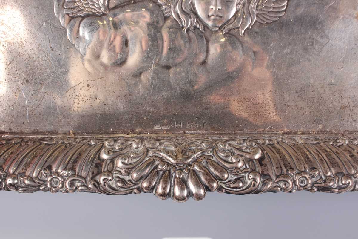 An Edwardian silver rectangular dressing table tray, embossed with amorini within a reeded and - Image 3 of 3