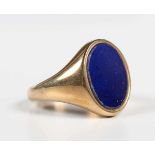 A 9ct gold and lapis lazuli oval signet ring, Sheffield 1976, weight 7.1g, ring size approx P1/2,