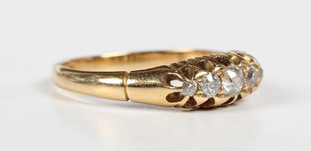 A gold and diamond five stone ring, mounted with old cut diamonds graduating in size to the centre